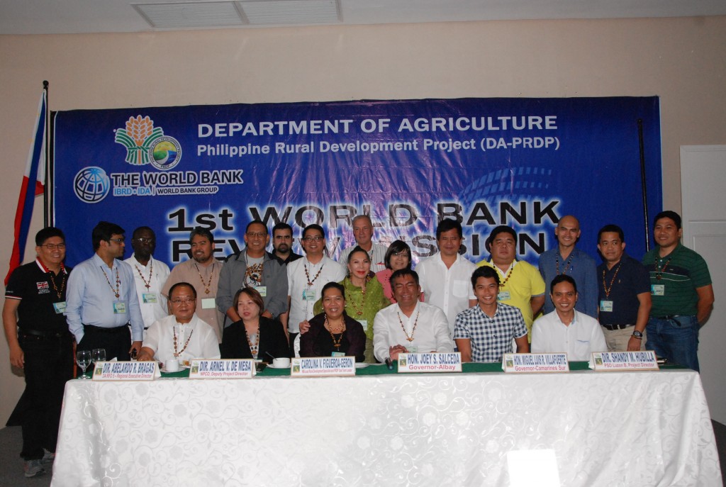 The team of officials from World Bank led by Carolina V. Figueroa-Geron (seated, third from left), PRDP National Deputy Project Director Engr. Arnel V. de Mesa (standing, 7th from left), DA-RFO V Regional Executive Director Abelardo R. Bragas (seated, 1st from left), and PSO Luzon B Project Director Shandy M. Hubilla (seated, 1st from right) together with the political leaders of South Luzon who expressed their support of the Philippine Rural Development Project, Albay Governor Joey S. Salceda (seated, 4th from left), Camarines Sur Governor Miguel Luis R. Villafuerte (seated, 2nd from right) Marinduque Governor Carmencita O. Reyes (standing, 7th from right), Camarines Norte Governor Edgardo A. Tallado (standing, 5th from right) and Guinayangan, Quezon Mayor Cesar J. Isaac III (standing, 4th from right).  