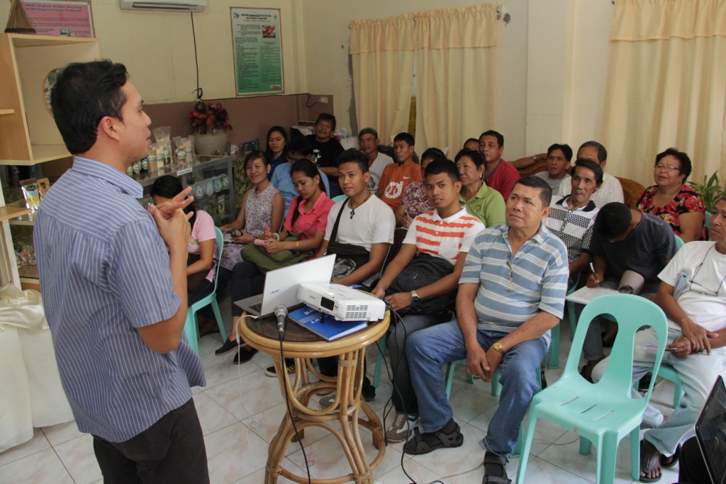 PSO South Luzon Director Shandy M. Hubilla  orients the  coconut  farmers  and representatives  of cooperatives in Camarines Sur about the benefits of the Village  Level  Coconut Water Processing Center’s operation  being  pilot tested at the Coco Water Processing  Technology Pilot Testing and Business Incubation  Facility  in  the Department of Agriculture Compound in San Agustin, Pili, Camarines Sur.   