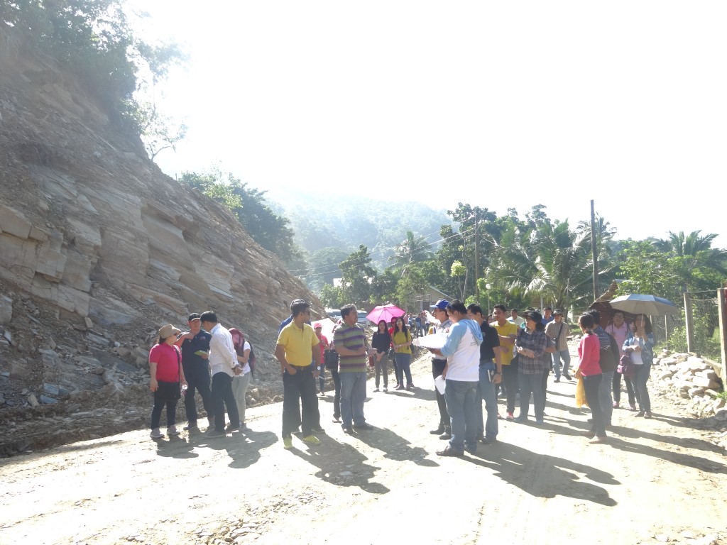 World Bank Project Team Leader Samik Sundar Das (in yellow), World Bank Social Safeguards Specialist Jonas Bautista (in striped polo shirt), PSO South Luzon I-BUILD Component Head Engr. Allan C. Tattiera (1st from right, in white and blue shirt) and NPCO I-BUILD Alternate Component Head Ericson T. Mammag (2nd from right) evaluate the Concreting of Bukang Liwayway-Makandring FMR in Brgy. Langogan, Puerto Princesa City along with other participants during the PRDP 1st Implementation Support Mission to South Luzon Cluster Site Visit on August 27, 2015.