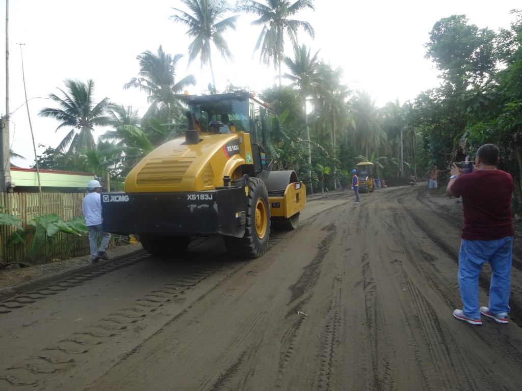 RPCO V Senior Rural Infrastructure Engineer Zosimo D. Ordas Jr. takes    geotagged photos of the equipment and manpower mobilization at the construction site of the Rehabilitation/Improvement of Pistola-Tablon Road with 3 units Bridges in Oas, Albay. 