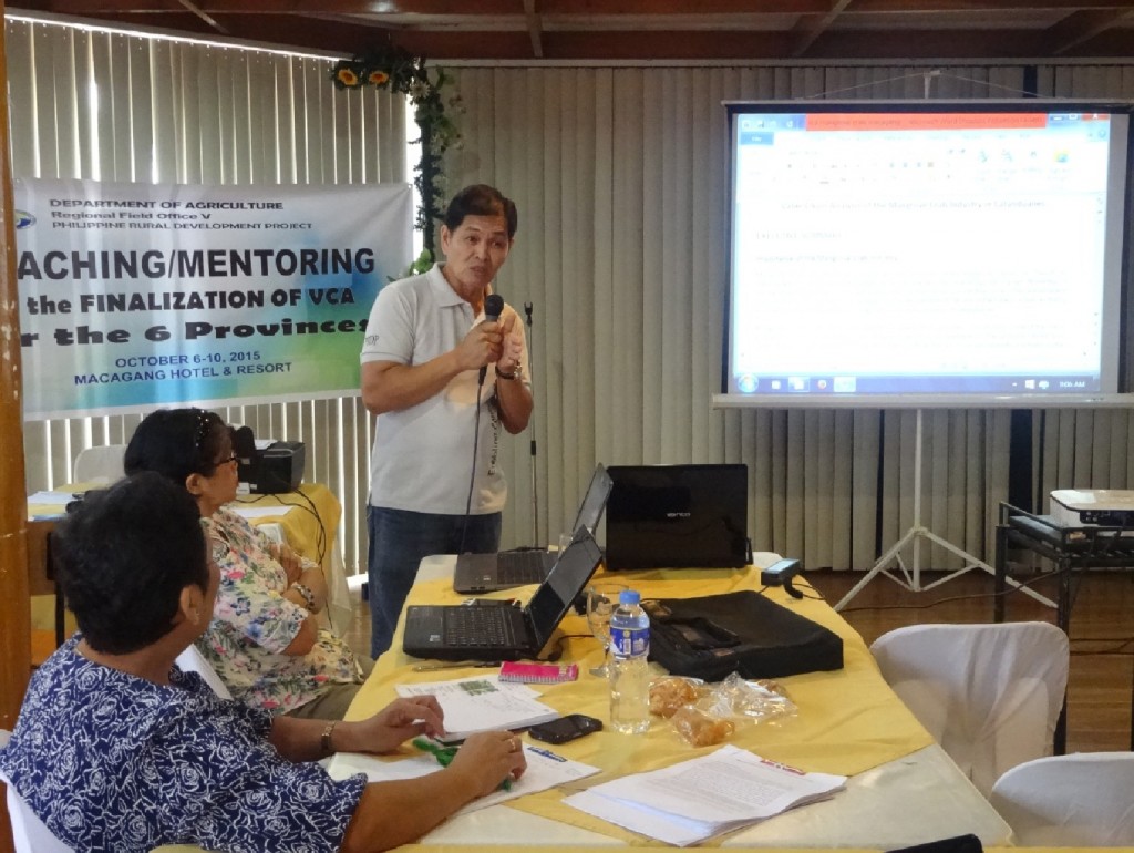 PPMIU-Catanduanes I-PLAN Component Head Romeo Aquino presents the draft VCA for mangrove crab to the panel of evaluators during the Coaching/Mentoring on the Finalization of VCA for the Province of Catanduanes and Camarines Norte held on October 9, 2015 at Macagang Hotel and Resort in Nabua, Camarines Sur.