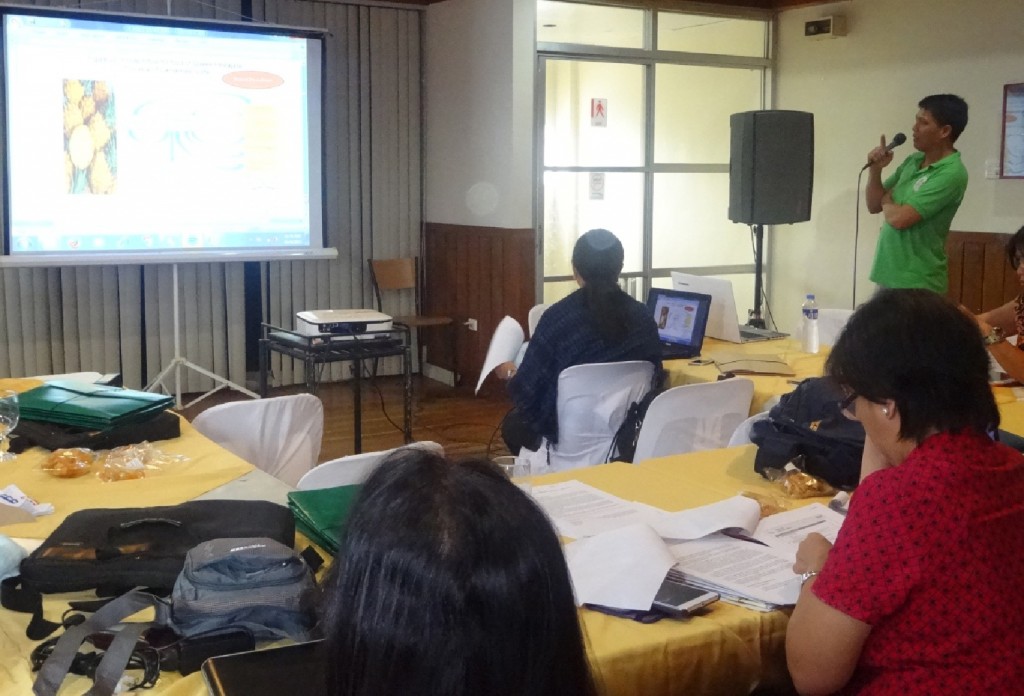 Raphy B. Belardo of PPMIU-Camarines Norte presents the draft VCA for queen pineapple juice to the panel of evaluators during the Coaching/Mentoring on the Finalization of VCA for the Province of Catanduanes and Camarines Norte held on October 9, 2015 at Macagang Hotel and Resort in Nabua, Camarines Sur.