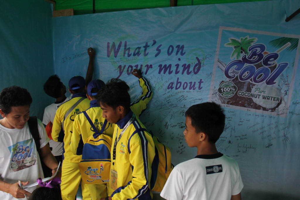 The Coco Water Product Testing and Product Promotion Booth/Exhibit Area installed at the Metro Naga Sports Complex in Pacol, Naga City for the Palarong Bicol 2016 features a freedom wall where guests can share their feedback about “Be Cool” coco water. 