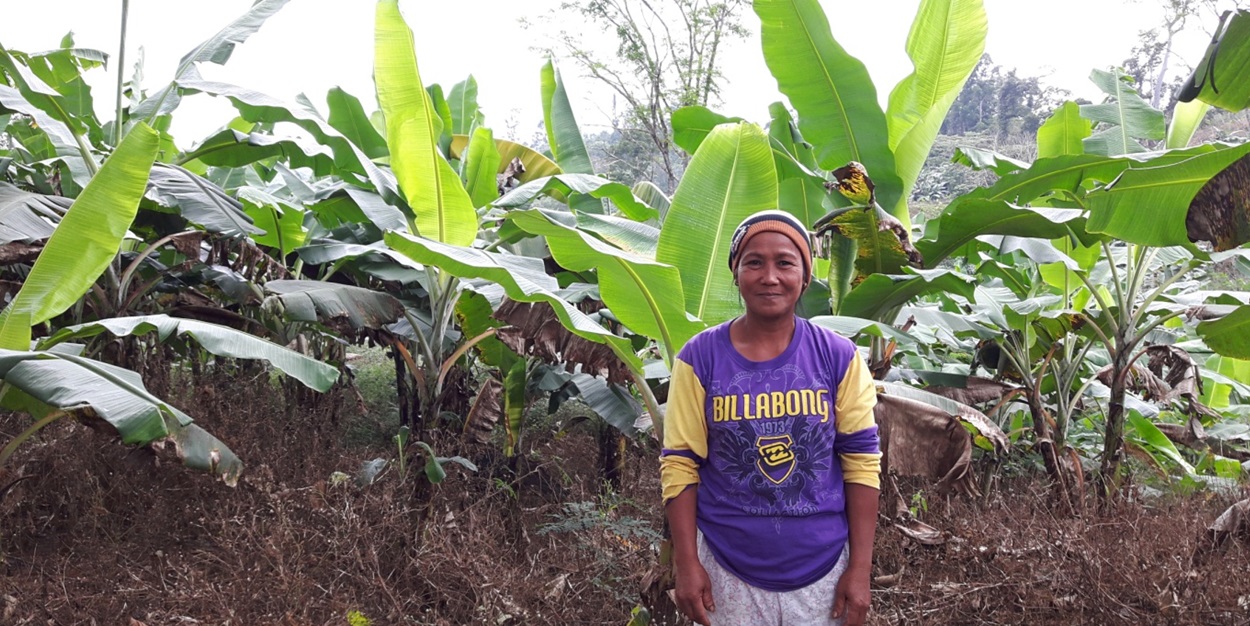 Millare, a farmer from Mallig, Flora, Apayao, proudly shows her banana plantation.