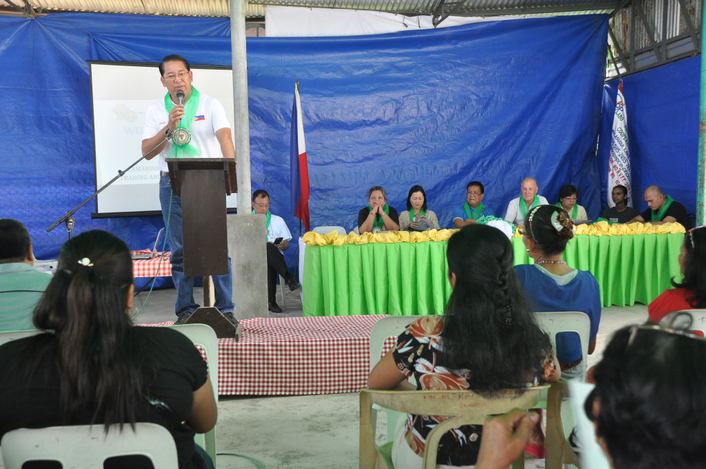 Camarines Norte Acting Governor Jonah G. Pimentel addresses the members of the LPMPC and other guests during the WB officials’ site visit to the Camarines Norte Queen Pineapple Trading and Processing Project in Labo, Camarines Norte. Seated at the head table (at the back, L-R) are NPCO I-REAP Component Head Dir. Bernadette San Juan, DA RFO V OIC-Regional Executive Director Dr. Elena B. De los Santos, NPCO I-PLAN Component Head Carlos L. Magnaye, WB I-PLAN Consultant Douglas Forno, WB Economist Luningning Bondoc, WB I-REAP Consultant Hanane Ahmed and WB Finance Consultant Tomas Sta. Maria. (Photo Credit: Hermito Antonio T. Privaldos) 