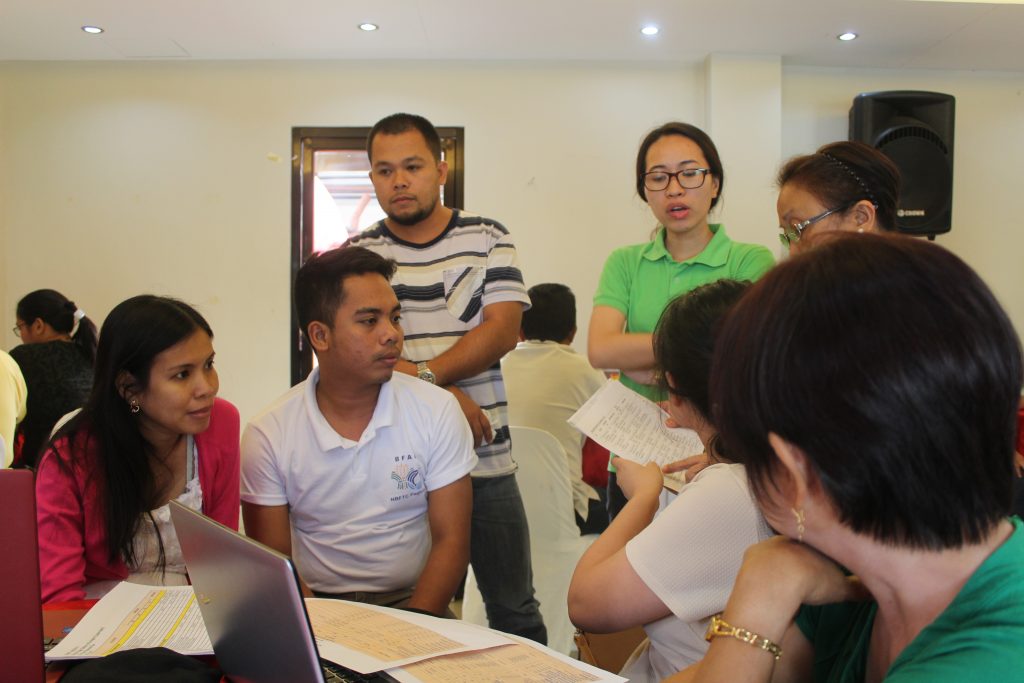 PRDP staff talks about the project cost together \with the representatives of Yakap at Halik MPC Quezon 2.
