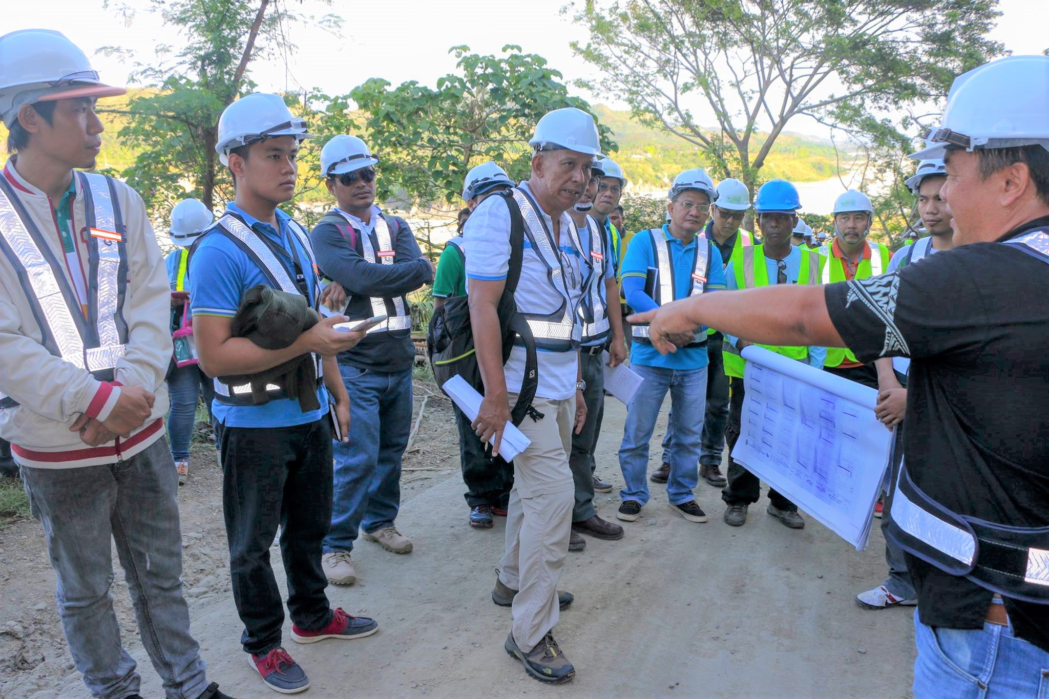 (L-R) PRDP Rural Infrastructure Engineers Denver Bandao, Shiedel Delicano, Ayson Romero, together with World Bank RIE Raoul Azanza (middle), Road and Bridge Specialist Engr. Dennis Flores (in blue, right side) and Project Engineer James Cadiogan (in black, far right) jointly assess the Bulanao- Amlao farm to market road during their visit on the 2nd day of the World Bank Implementation Support Mission.