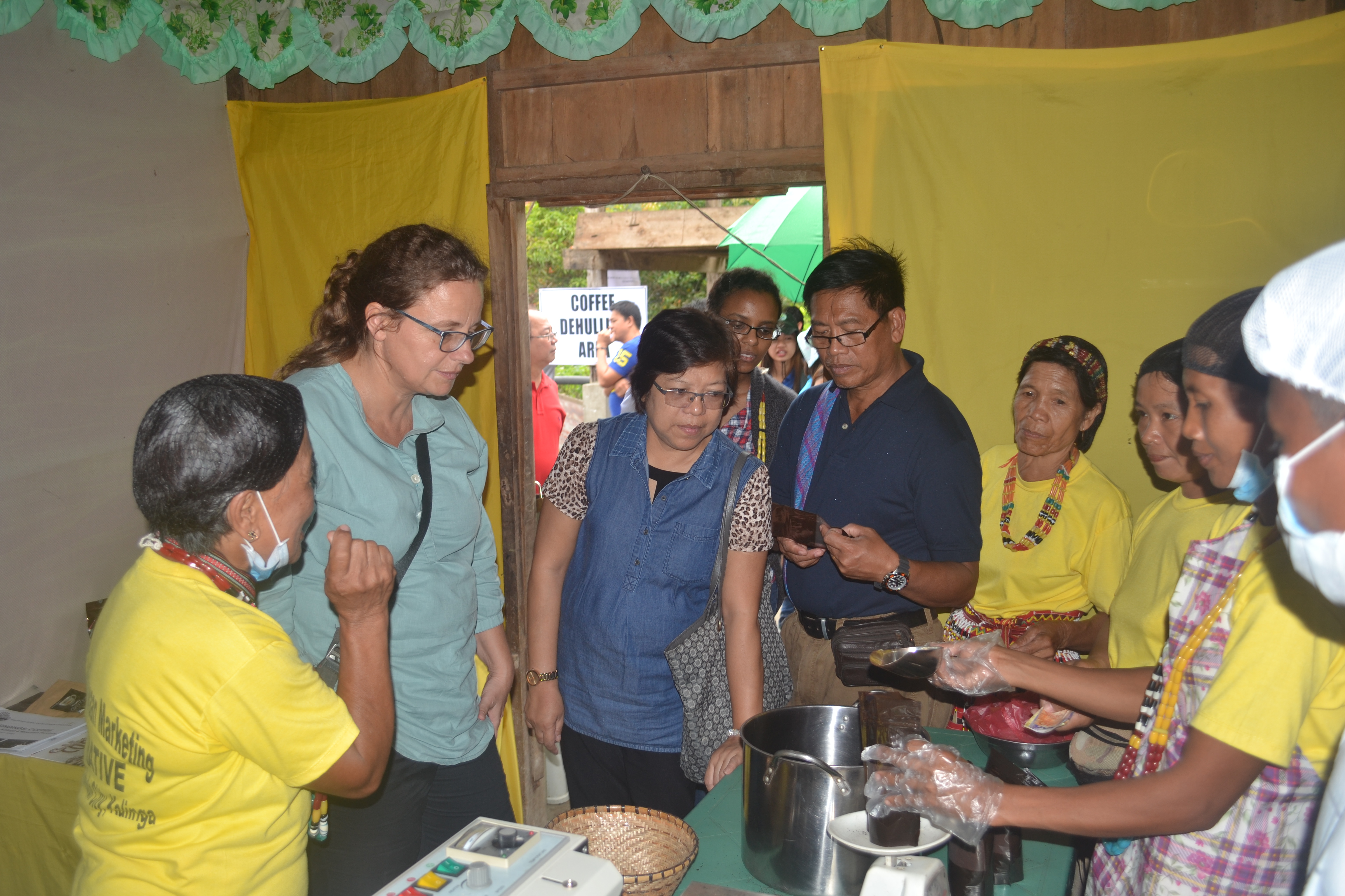 Members of the Gawidan Malin-awaan Marketing Cooperative present the process of coffee making to WB Task Team Leader Frauke Jungbluth, Economist Luningning Bondoc and RED Lorenzo Caranguian.