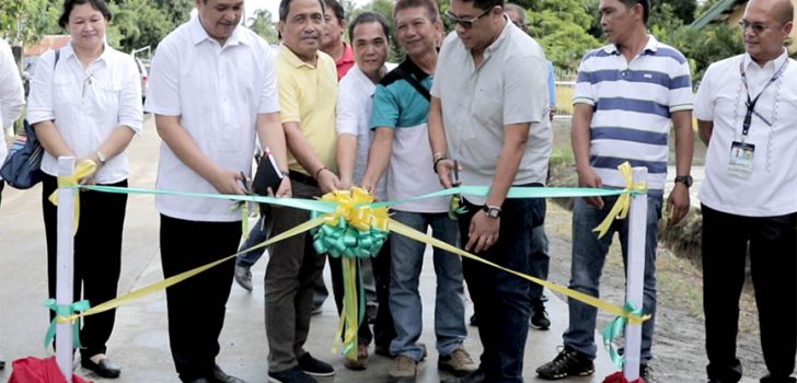 Davao del Norte Gov. Anthony del Rosario (3rd from the right) and Panabo City Mayor James Gamao (6th from the right) lead the inauguration of the 8-km farm-to-market road values at P61.9 million. Looking on are (L-R) Miguela Edquila, DA-RPCO-XI M&E Unit Head; Engr. Carl Orbe of PRDP-PSO Mindanao; Davao del Norte Provincial Engr. Raul Mabanglo (extreme R); and the barangay officials. (Photo Credit: Janelle Flores/DA-XI)